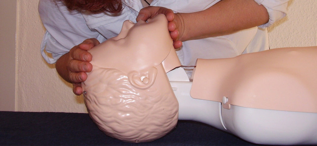 First Aider practising with a Resus Annie