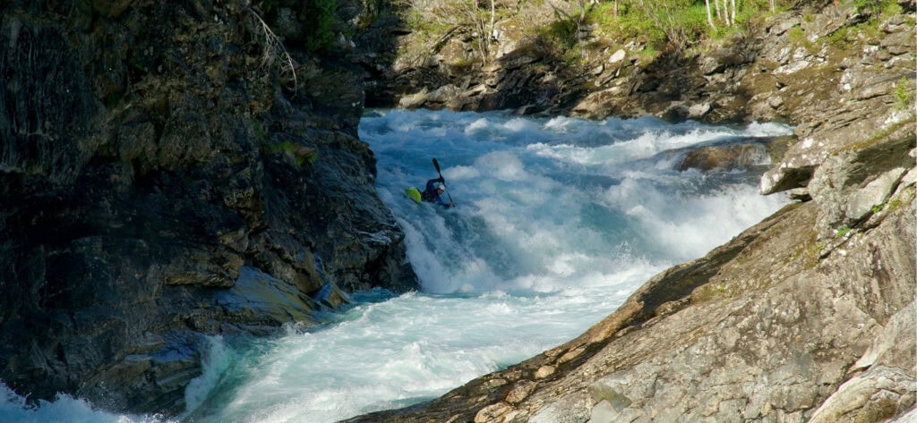 Photo of White Water Coach Alex Littlechild paddling on White Water.