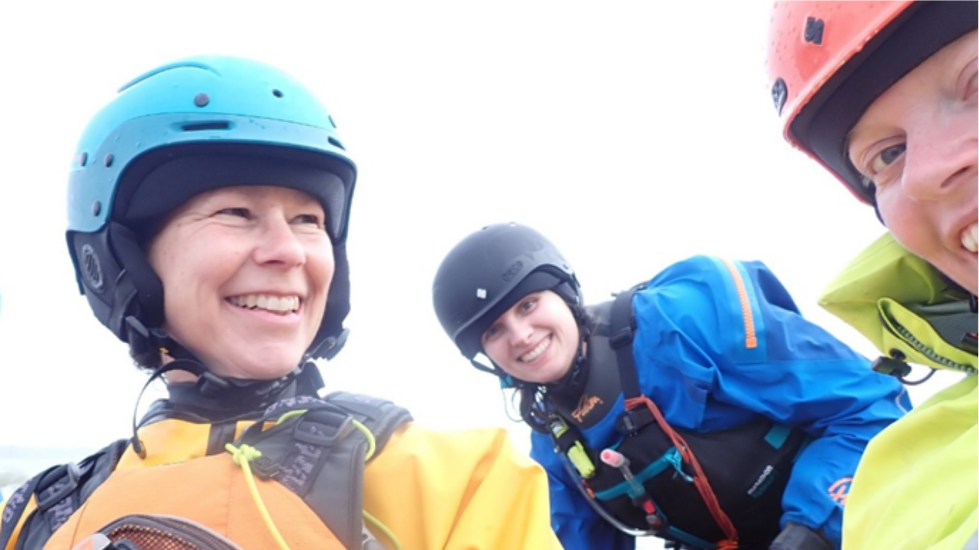 Ida, Joanna and Marianne smiling, enjoying some surf on a trip to the Gower 